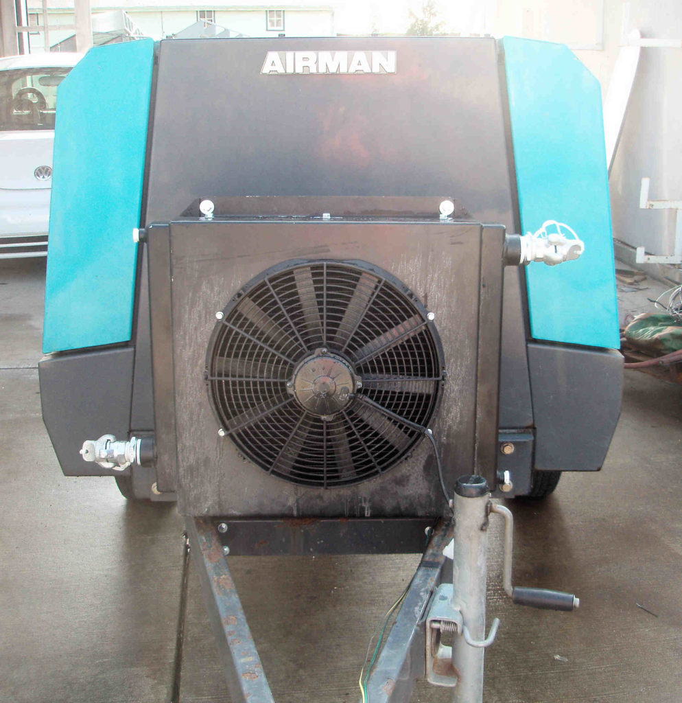 400 CFM aftercooler mounted to tongue of air compressor